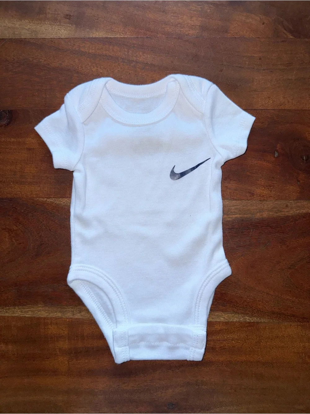 Nike‎ White Infant Bodysuit with Black Swoosh